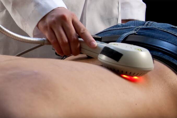 Laser therapy being used on the spine